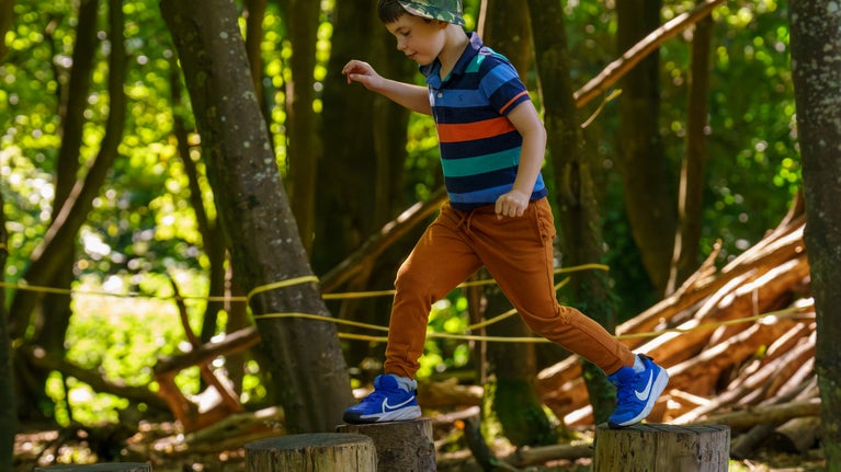 Boy plays at Summer of Play Mount Stewart